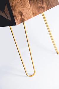 Gold hairpin legs create a precarious illusion, and match the metal highlights elsewhere on the piece