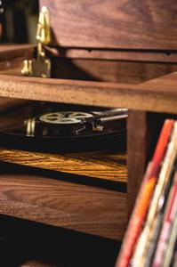 A custom turntable provided by U-Turn Audio of Boston, MA and made from the same Zebra wood as LSTN's audio products.